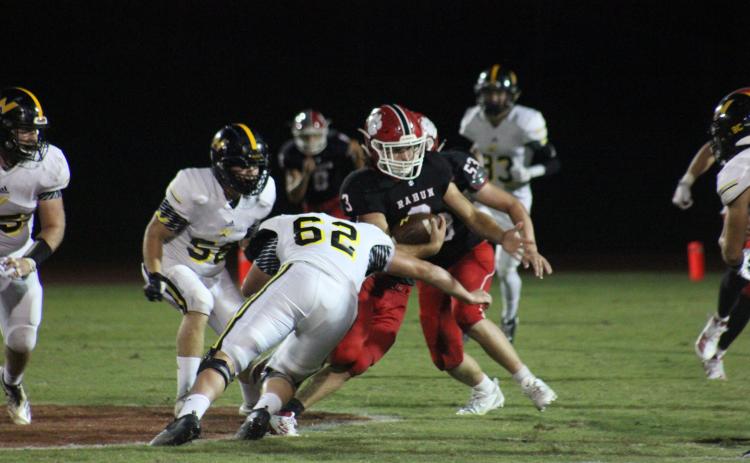 North Murray defensive lineman Hayden Jones (62) attempts to tackle Rabun County linebacker AJ Wheeler (3) after an interception during the second half at Frank Snyder Memorial Stadium in Tiger on Aug. 30. (Glendon Poe/The Clayton Tribune)