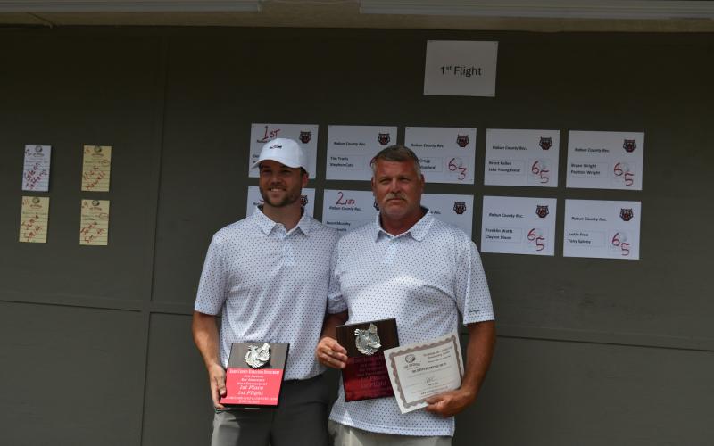 Wade Cheek/The Clayton Tribune. Nick Howell (left) and Dennis Hendricks collect their first-place awards during the ninth annual golf tournament hosted by the Rabun County Recreation Department at the Orchard Golf and Country Club on Tuesday, June 18. 