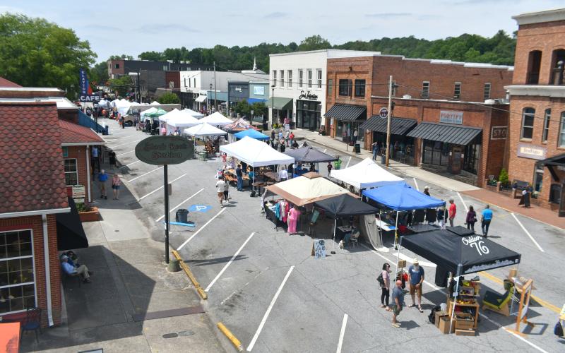 Wade Cheek/The Clayton Tribune. The downtown streets of Clayton begins to fill around 10 a.m. on Saturday, June 1 as the local businesses and vendors set up on Main Street for the first-ever Ramshackle event. 