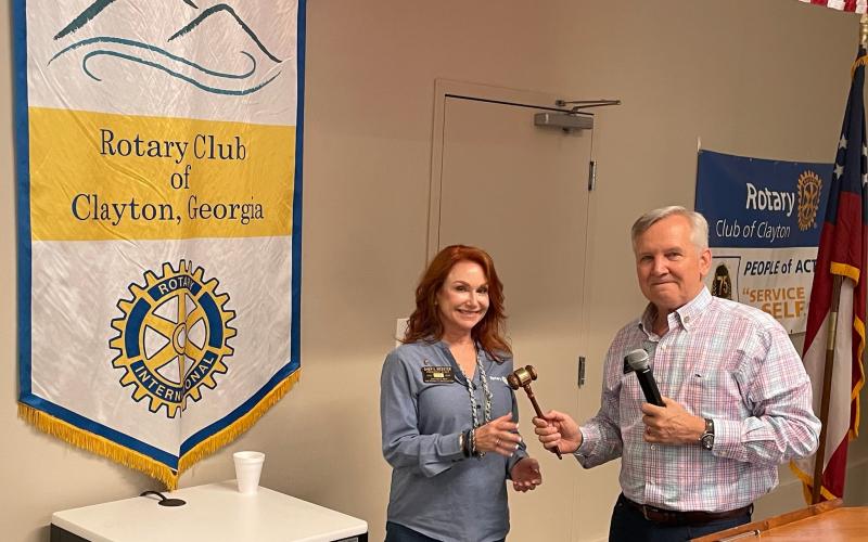 Photo courtesy Laura Seberg. The Rotary Club of Clayton installed its 2024-2025 leadership team during an event at The Dillard House on Thursday, June 20. Gerald Hulett passes the gavel to incoming president Sheryl Webster, who will lead the club with the Rotary International theme of “The Magic of Rotary.” 